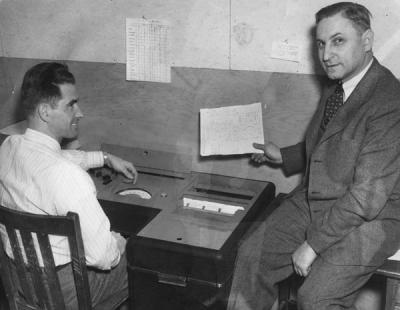 <p>Dr. Robert R. Reichart and Lawrence W. Carrillo, Jr. using a machine to check tests for the counseling and testing service, 1949. Robert R. Reichart received a B.S. in Commerce from Oregon State University in 1917 and</p><p>				retired in 1974 as a Professor Emeritus of both Education and Forestry. Reichart taught courses in educational psychology, his focus centered on a student's ability to learn on their own using multimedia resources.</p><p>				Eventually Reichart created a center for self-learning on campus.</p>