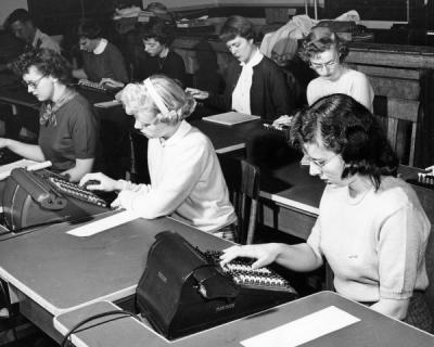 Students using calculators in an office procedures class, 1951.