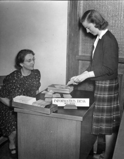 Bertha Herse and a student at the catalog room information desk on the second floor of the Library, later known as Kidder Hall, ca 1940s.