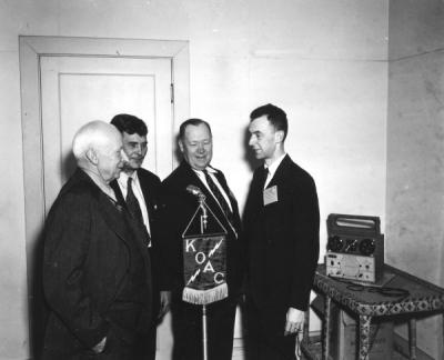 <p>New KOAC wire recorder in use at the Western Oregon Livestock Association meeting, December 1946. Pictured from left to right: R. C. Burkhart, Lebanon, retiring president of the organization; Albert Julian, Lyons, newly</p><p>				elected president; H. A. Lindgren, veteran extension animal husbandman; and Arnold Ebert, farm program director of KOAC. Lindgren served as the first president of the Steak and Chop Club.</p>