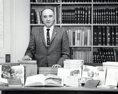 J. Kenneth Munford posing with OSU Press books, 1962. Munford received a degree in Education in 1934 from Oregon State College and from 1939-1941, he served as instructor for the English Department. In 1948 Munford became an editor for the Office of Publications, later being promoted to Director of Publications in 1956. He helped lead the founding of the OSU Press in 1961 and served as its first director.