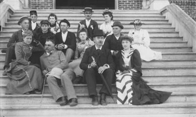 John McKnight Bloss seated with students, ca. 1894. Bloss sits in the middle of the bottom row.
