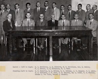 Forestry faculty group photo, January 1956. Tony Van Vliet stands back row, second from right. Seated (left to right): H. I. Nettleton, J. R. Dilworth, W. F. McCulloch, George H. Barnes, W. A. Davies, H. R. Patterson, W. I. West. Standing (left to right): R. F. Keniston, R. L. Wilson, M. D. McKimmy, J. T. Krygier, T. C. Adams, D. D. Robinson, C. W. Dane, R. M. Malcolm, Ray A. Yoder, W. P. Wheeler, Antone C. Van Vliet, Warren R. Randall.