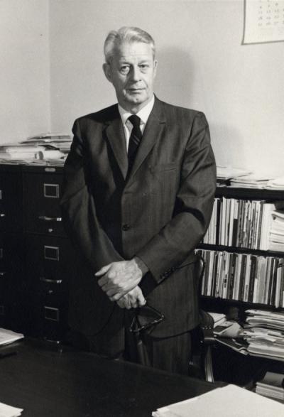 Henry P. Hansen standing in his office, ca. 1960s. Hansen came to Oregon State College in 1939 as an Instructor in Botany. He became Dean of the Graduate School in 1949, a position he held until his retirement in 1971.